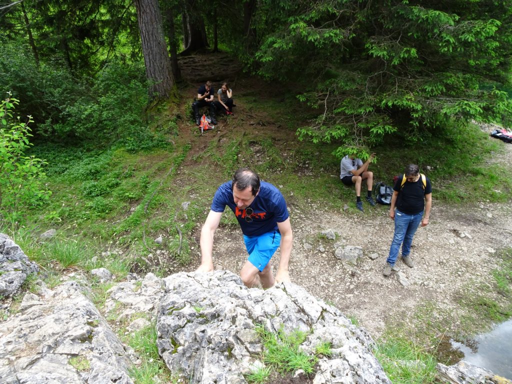 Hans climbing up the rock