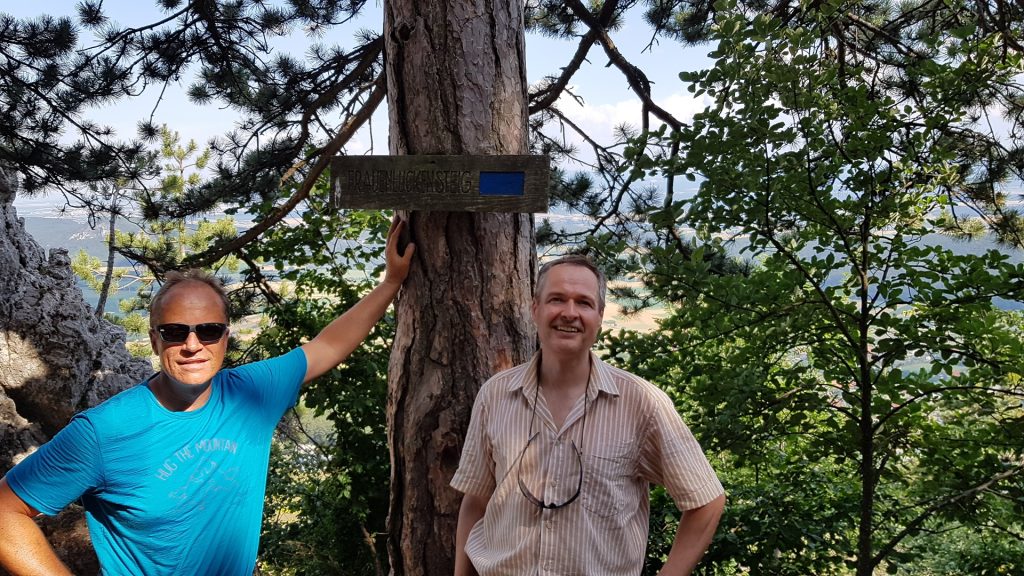 Werner and Herbert posing in front of the Signpost