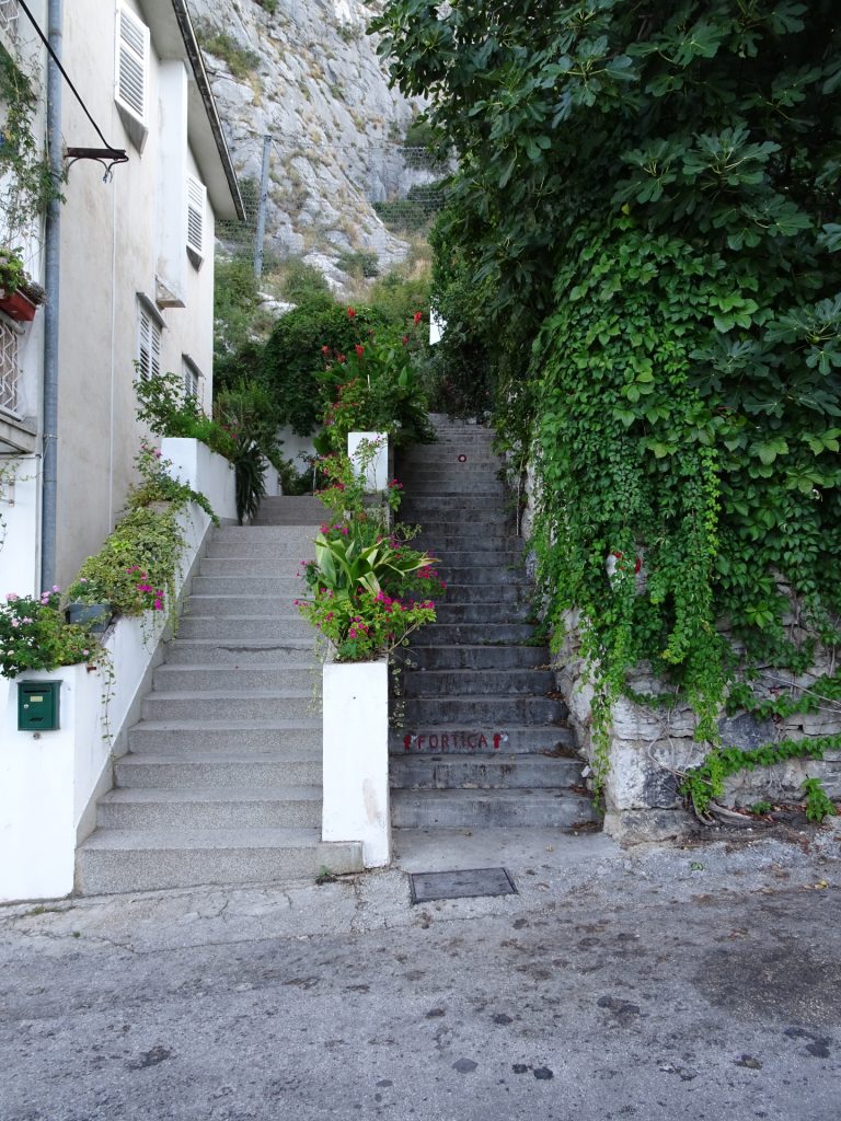 Use the stairs on the right hand-side