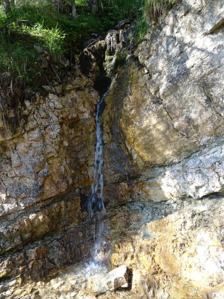 Refreshing waterfall next to the trail