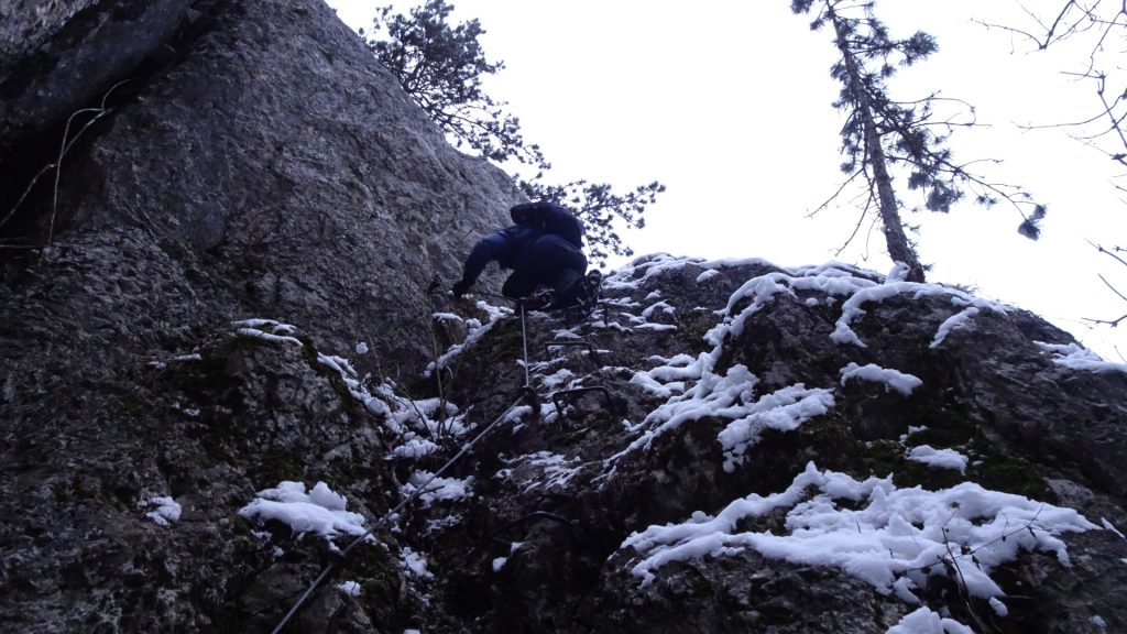 Robert climbing down the iron rungs at "Leiterlsteig"