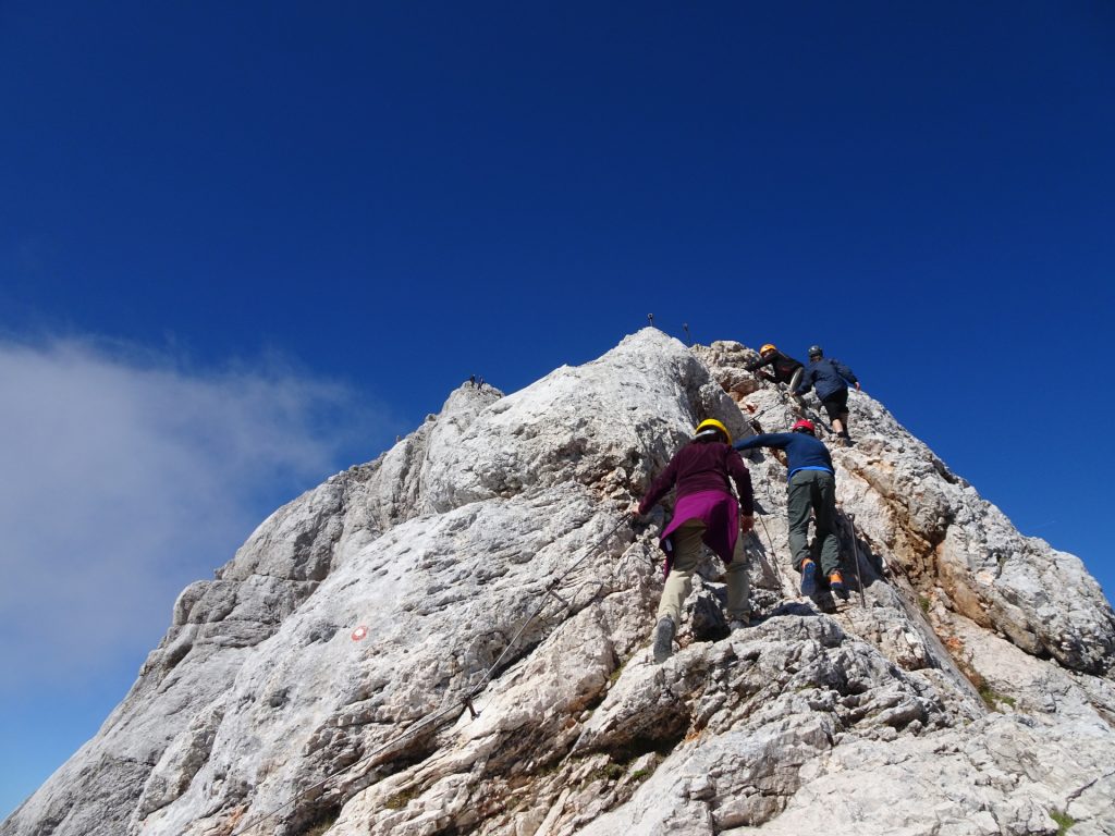 Climbing up the "Zavarovana Plezalna Pot" towards the summit of "Triglav"