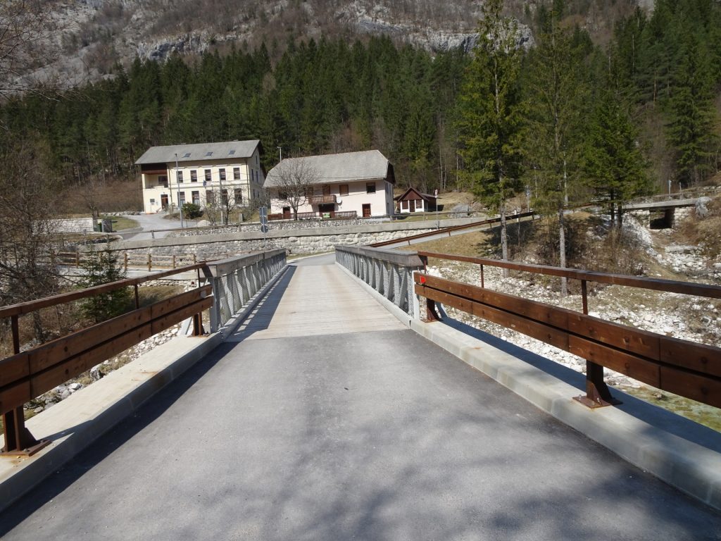 Cross the bridge towards the village of Soča