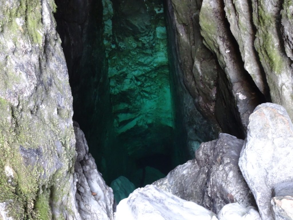 Looking into the cave with the source of Soča river