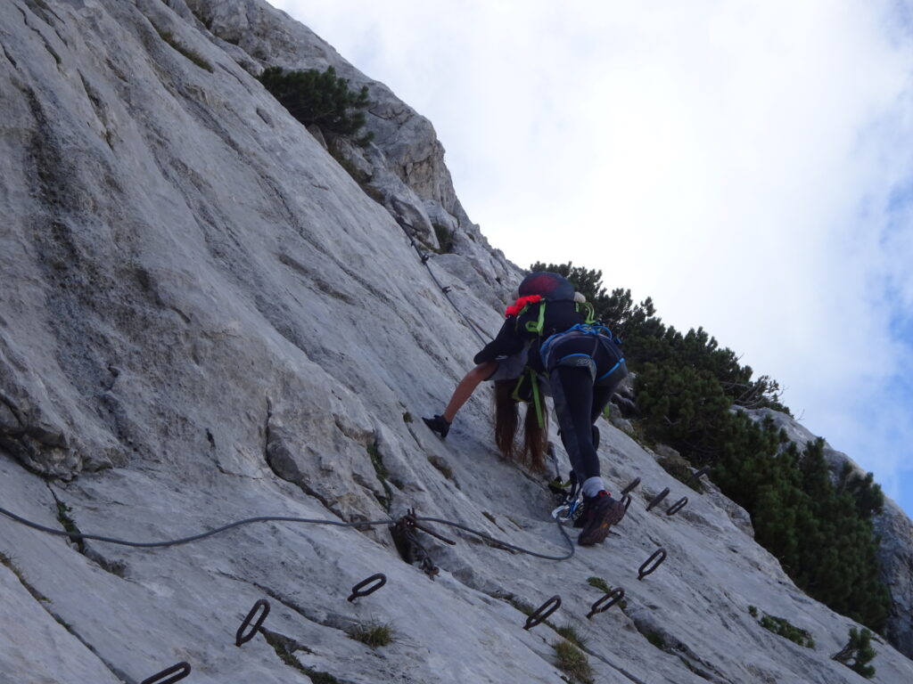 Eliane climbs down the Via Ferrata