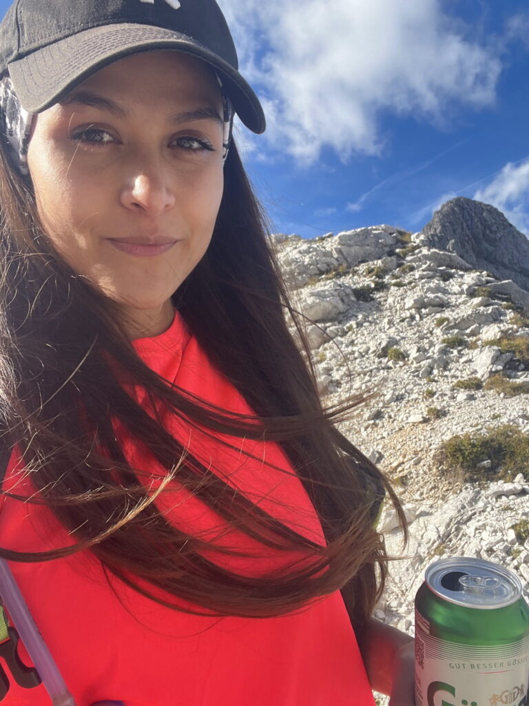Eliane drinks an Austrian beer at the most southern point of Austria