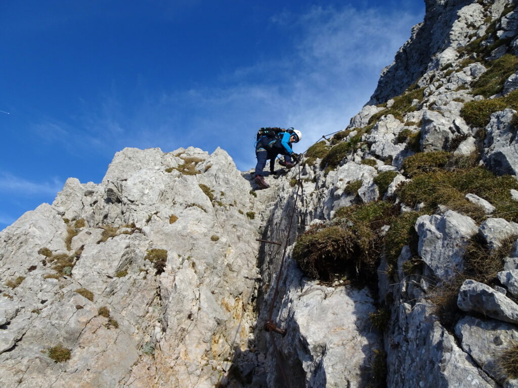 Eliane climbs down the last few meters of the via ferrata