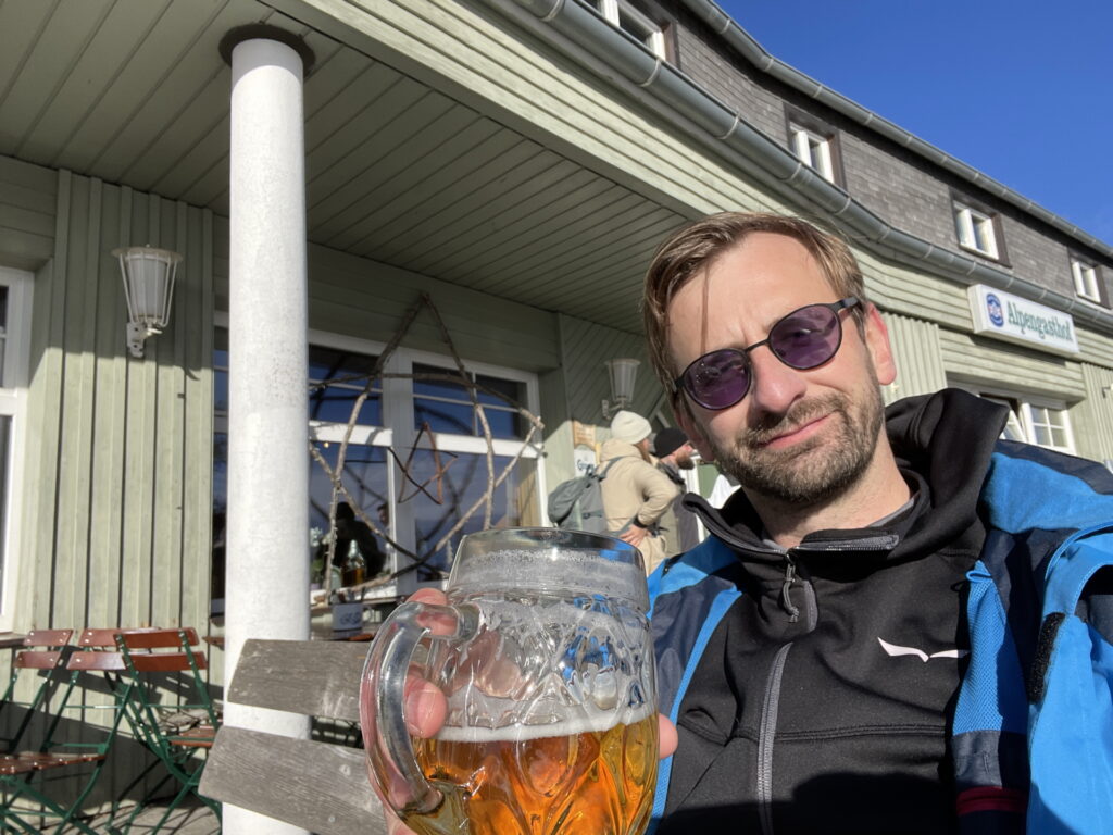 Stefan enjoys a refreshment and the sun at <i>Almgasthof</i>
