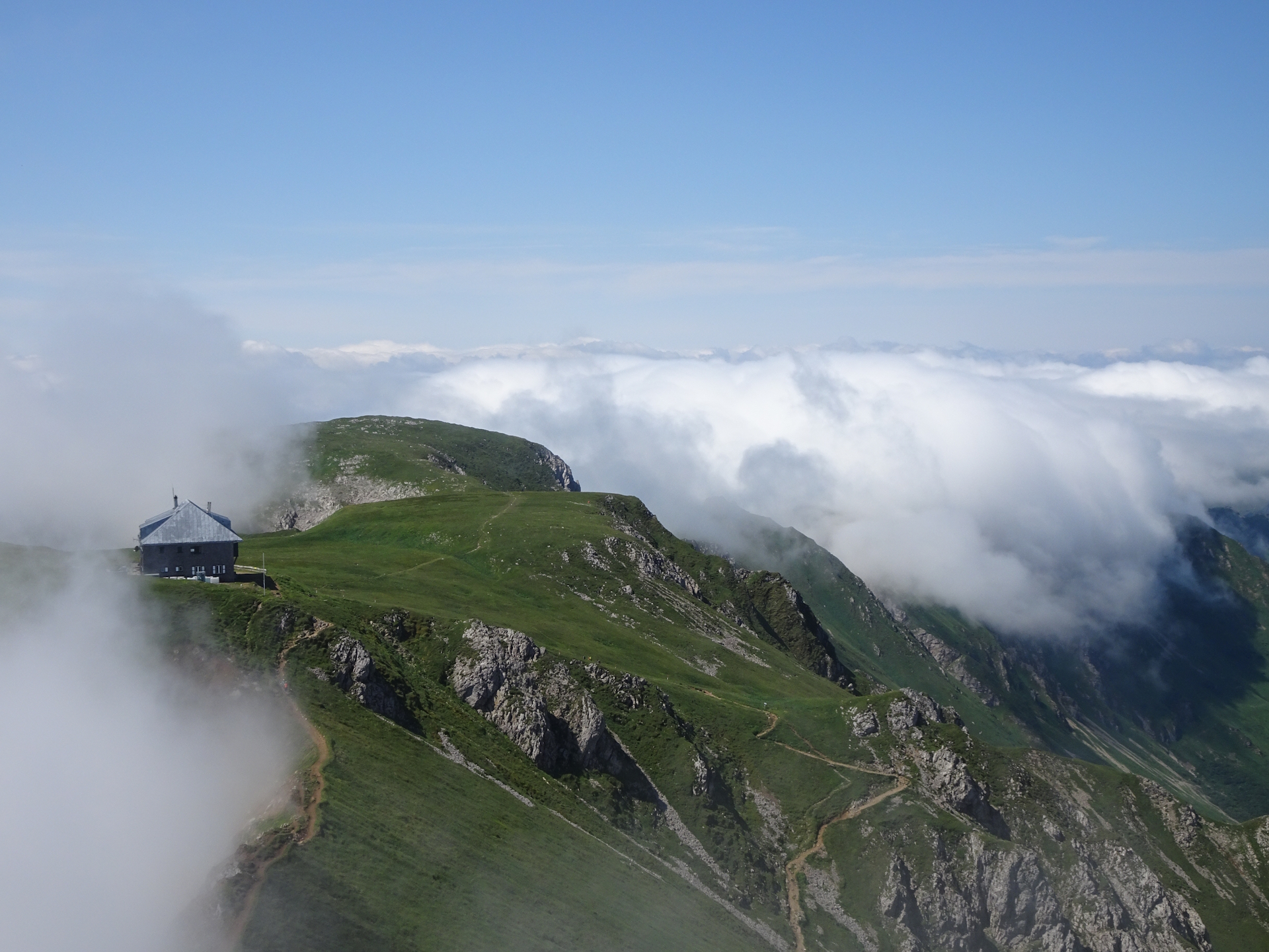 The <i>Reichensteinhütte</i> being surrounded by clouds