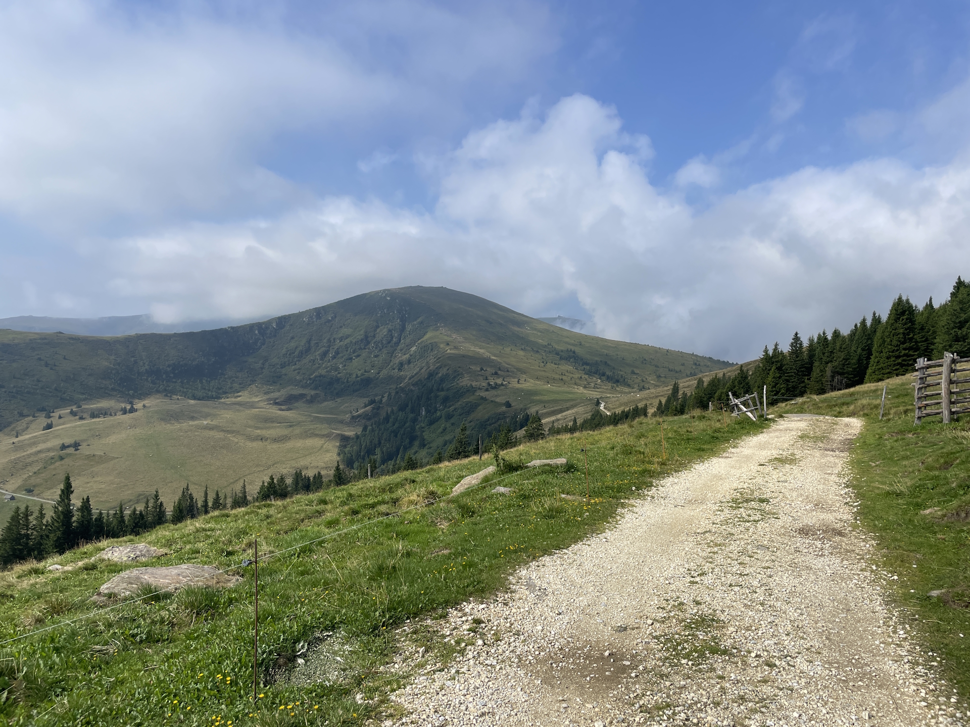 A first glimpse on <i>Hühnerstütze</i> and <i>Großer Speikkogel</i> (in between the clouds)